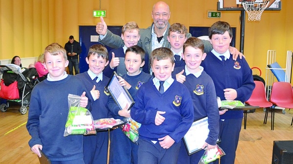 Hail to the heroes! Former Irish soccer international, Paul McGrath, shows his appreciation for heroic youngsters