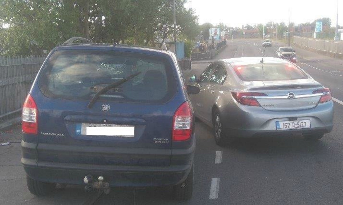 Disqualified motorist caught driving while drinking beer and using mobile phone