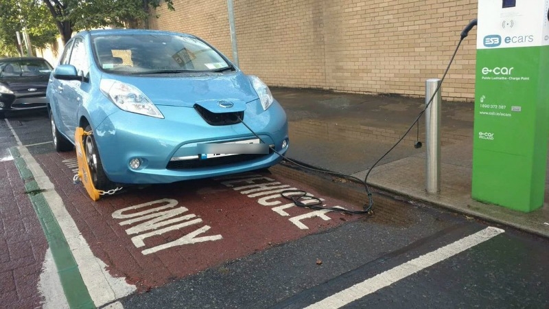 Electric car clamped at charging point is no surprise