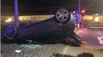 Car overturns after going through roundabout