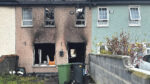 Newborn baby is evacuated  after house firebomb attack