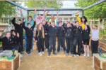 Difference Day volunteers create a new outdoor classroom in the school garden