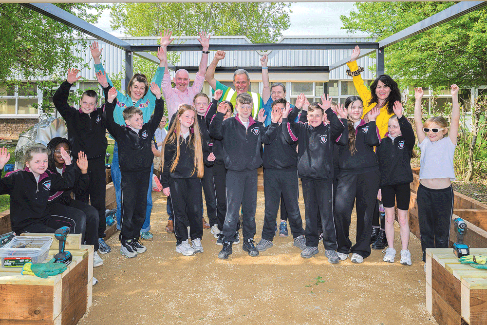 Difference Day volunteers create a new outdoor classroom in the school garden Difference Day volunteers create a new outdoor classroom in the school garden