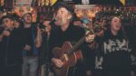 Tributes to Glen sung by local buskers at Luke Kelly statue