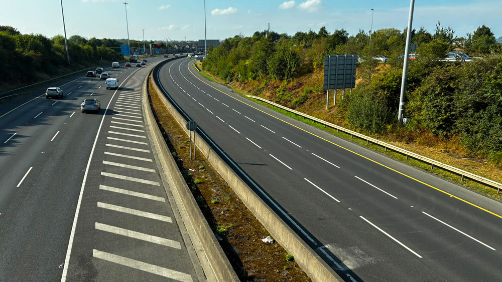 M50 closed at Ballymount after car goes through security fence M50 closed at Ballymount after car goes through security fence